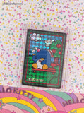 2024 Sanrio Tuxedosam In the Park Trading Prism Shiny Holo Sticker - NM